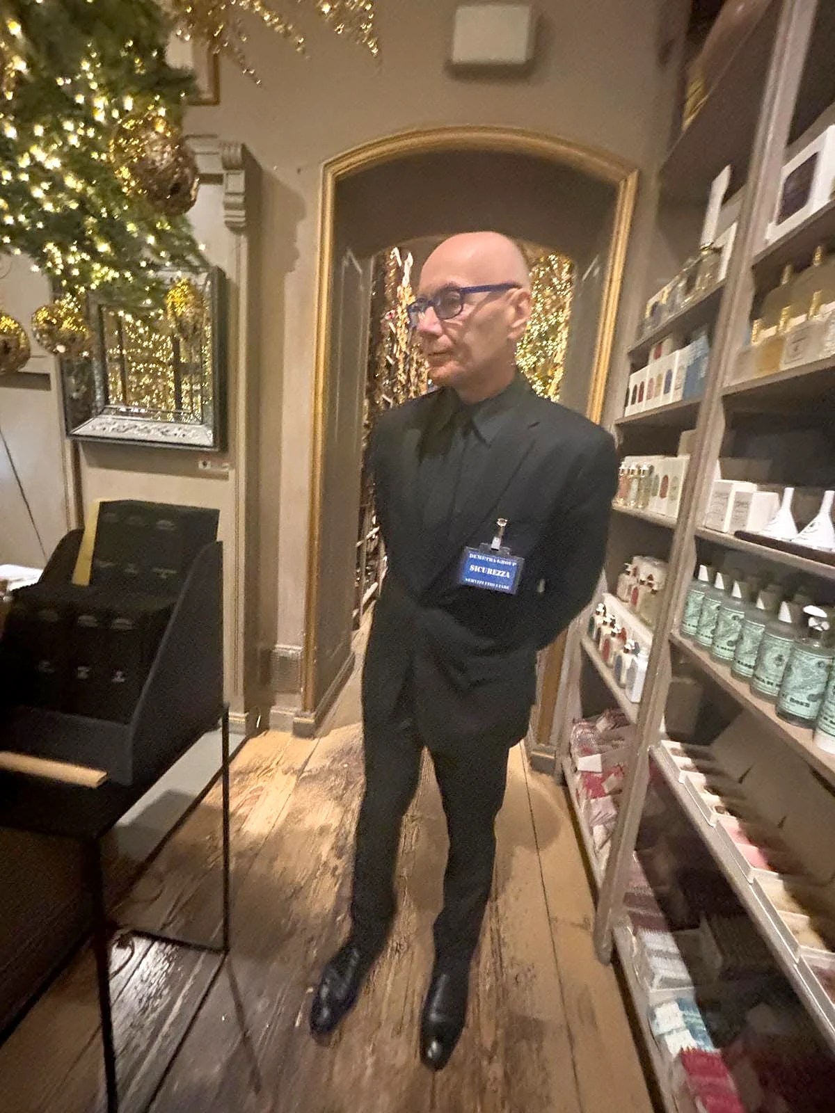 Demetra Group concierge and access-control officer on duty in a perfumery store